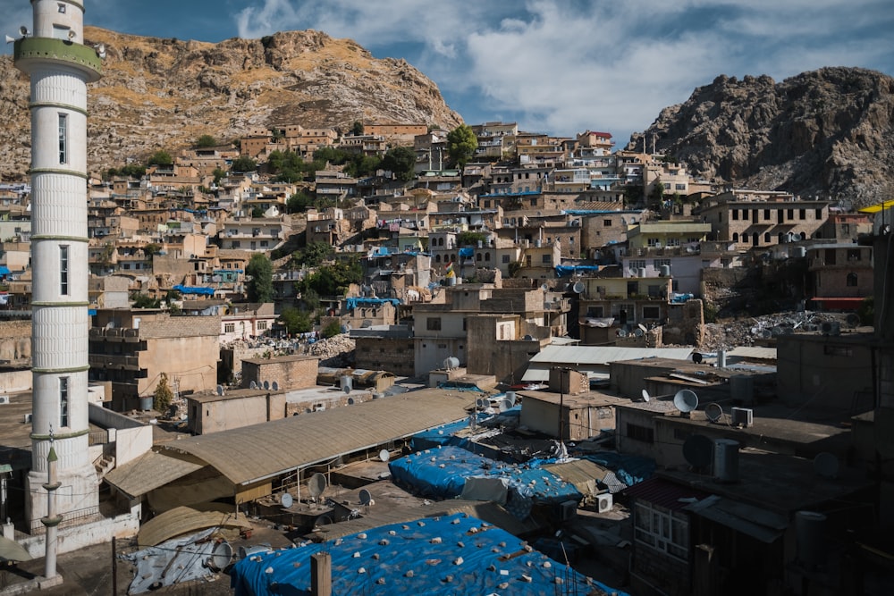 aerial view of city buildings near mountain during daytime