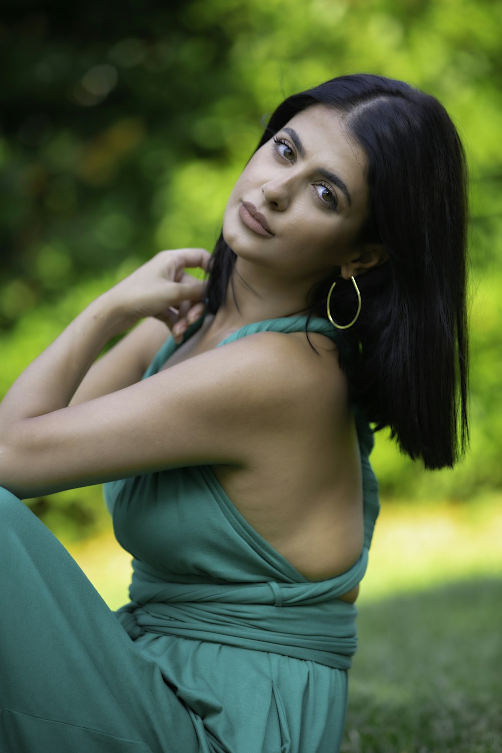 woman in green spaghetti strap top