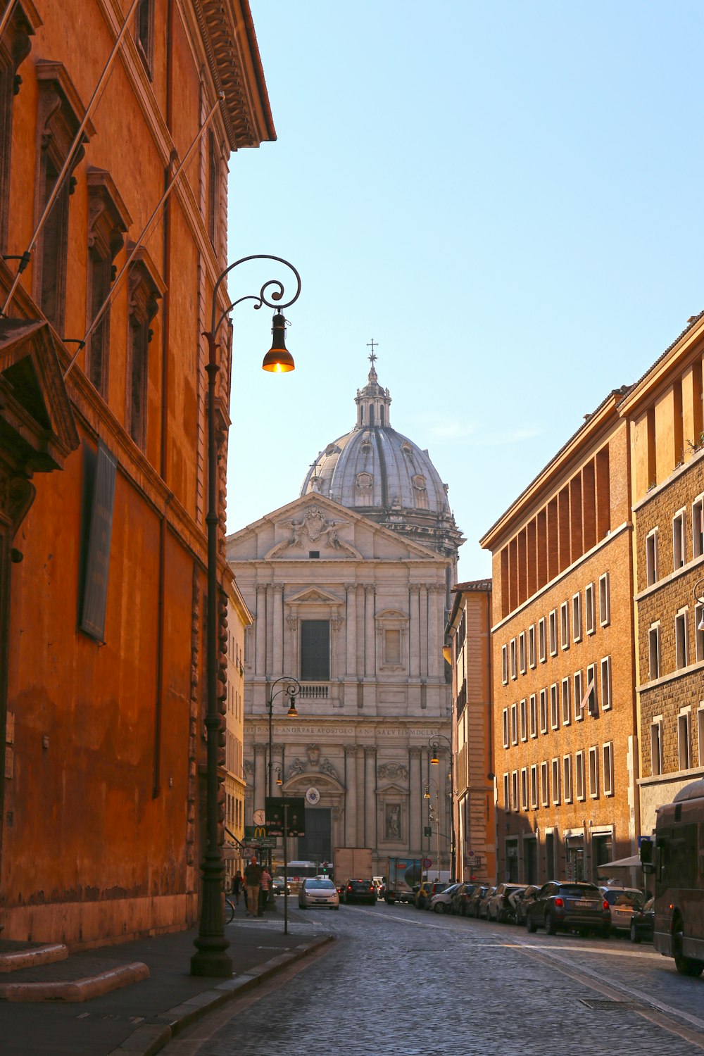 a city street with a church in the background