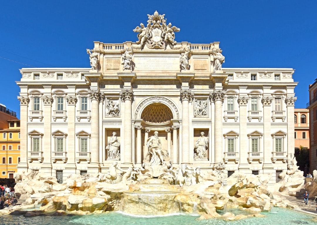 a fountain in front of a building with statues on it, 许愿池“证照”