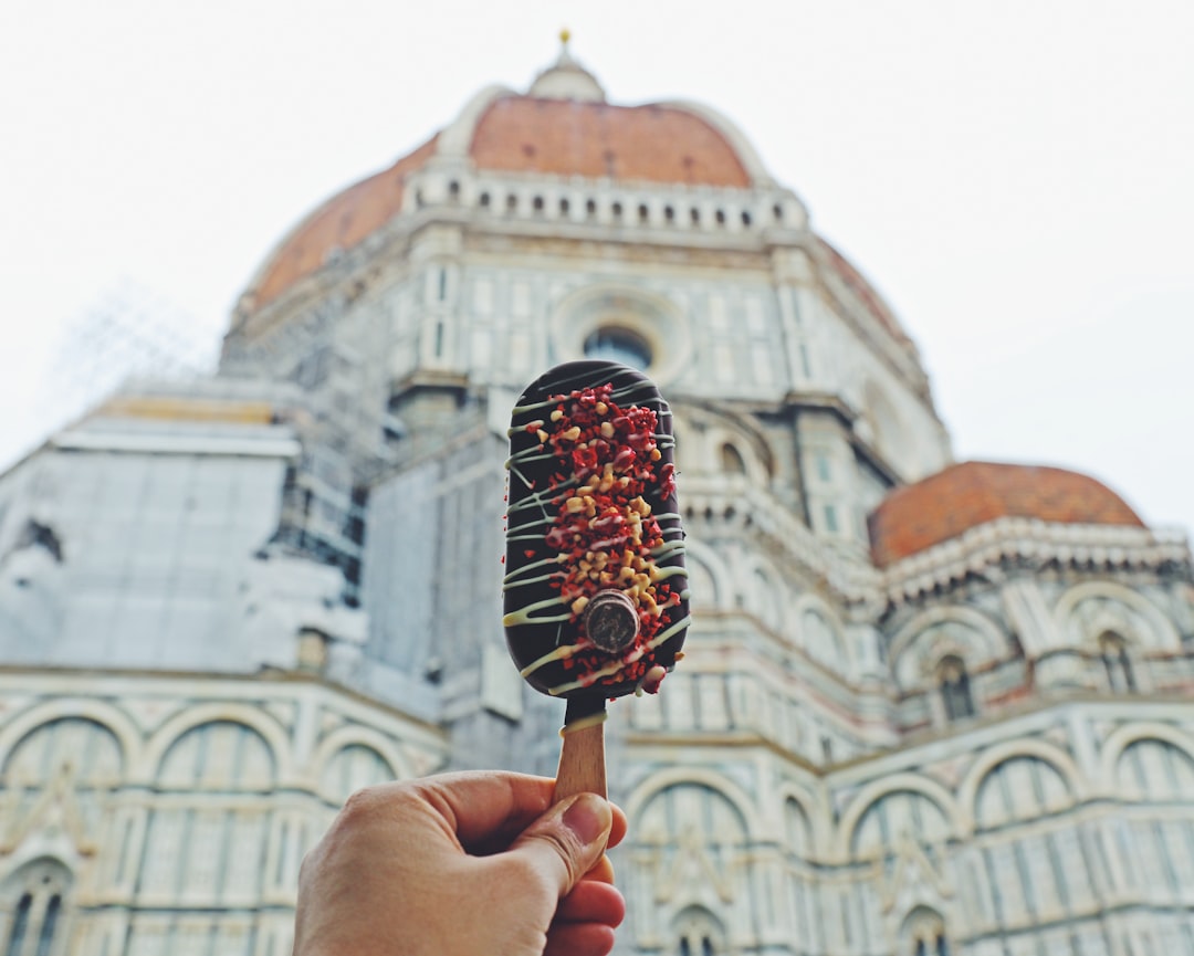 person holding ice cream cone