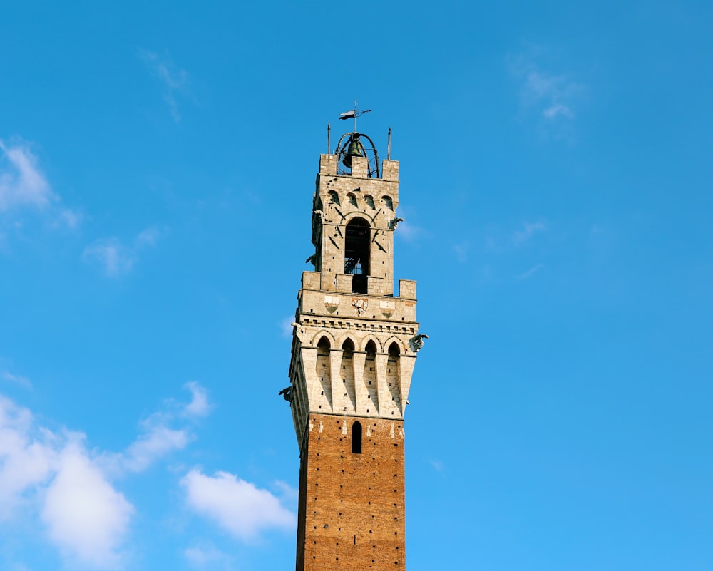 brown concrete tower under blue sky during daytime