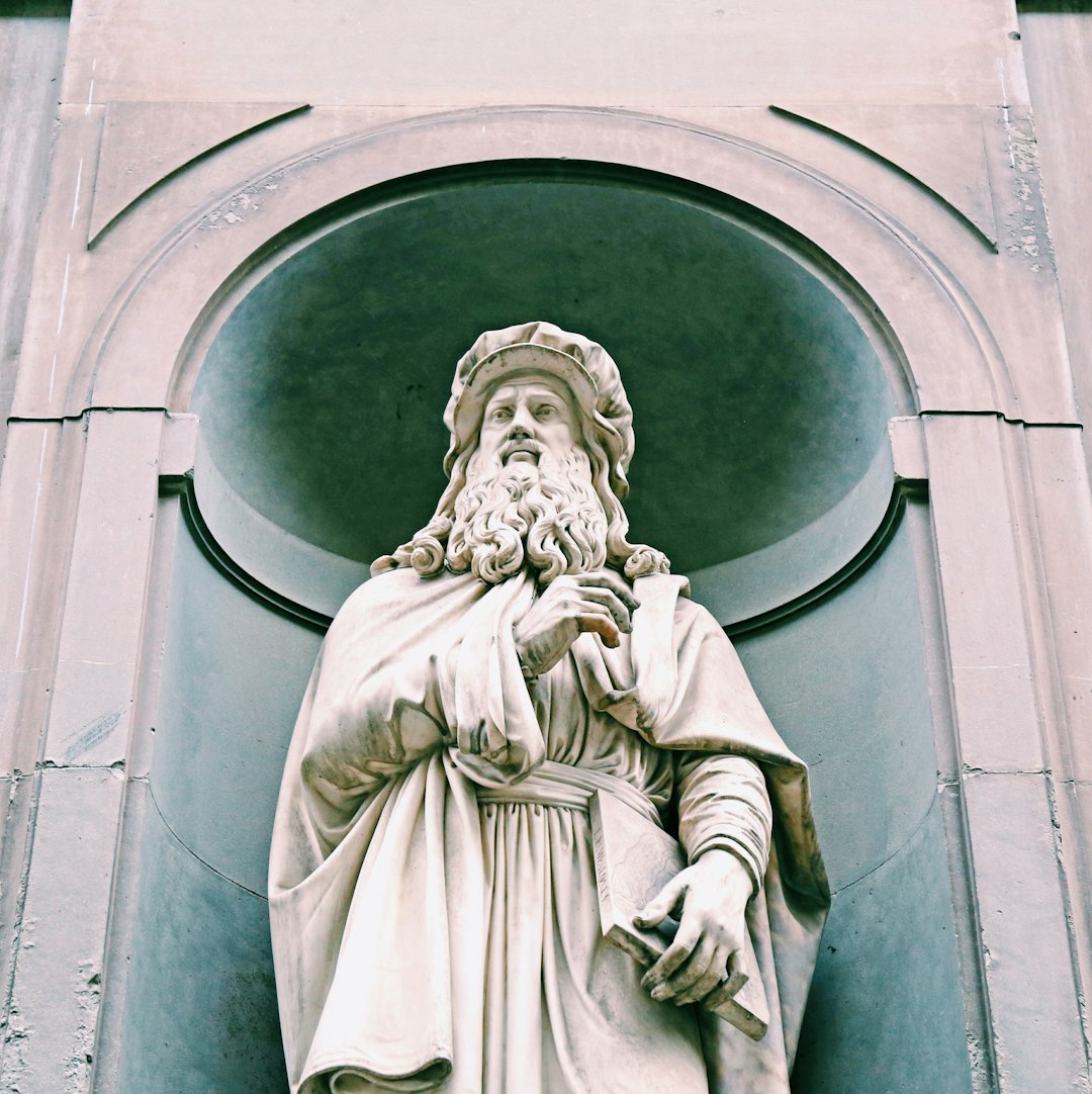 white concrete statue of man