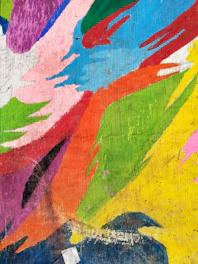 A vibrant painting on wooden panel with bold brush strokes and rich textures.