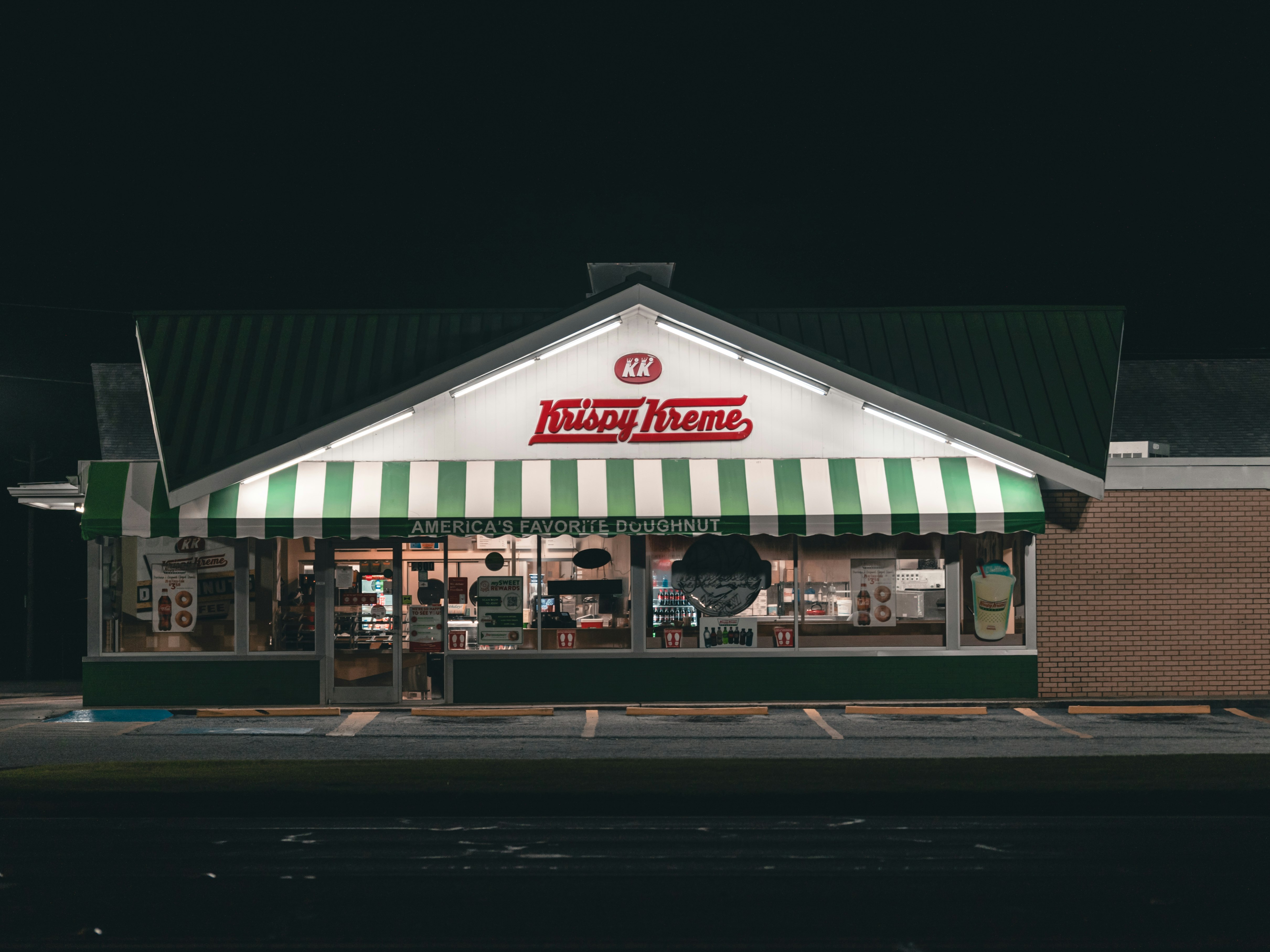 white and green food store during night time