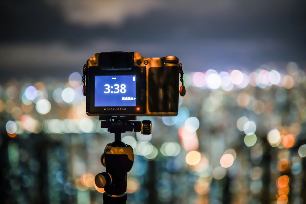 black dslr camera showing city lights