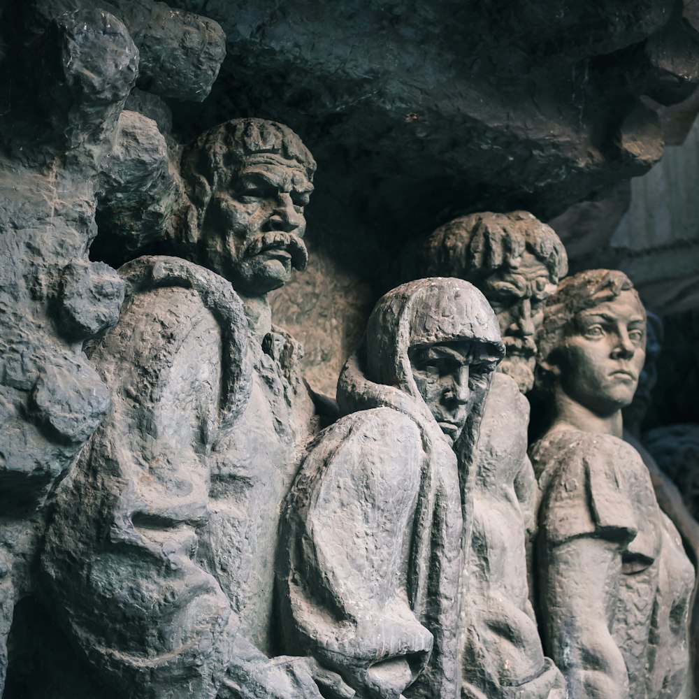 gray concrete statue of man and woman