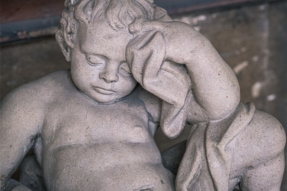 gray concrete statue of a woman