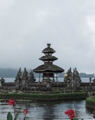 A traditional Balinese temple surrounded by tropical foliage.