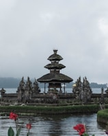 Traditional Balinese temple surrounded by greenery.