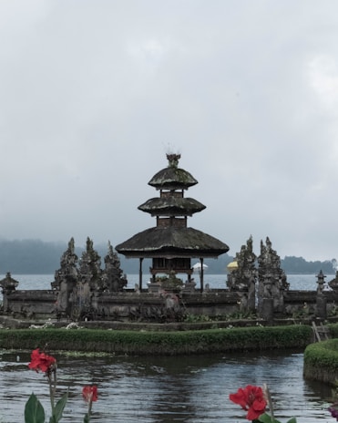 A traditional Balinese temple surrounded by lush greenery.