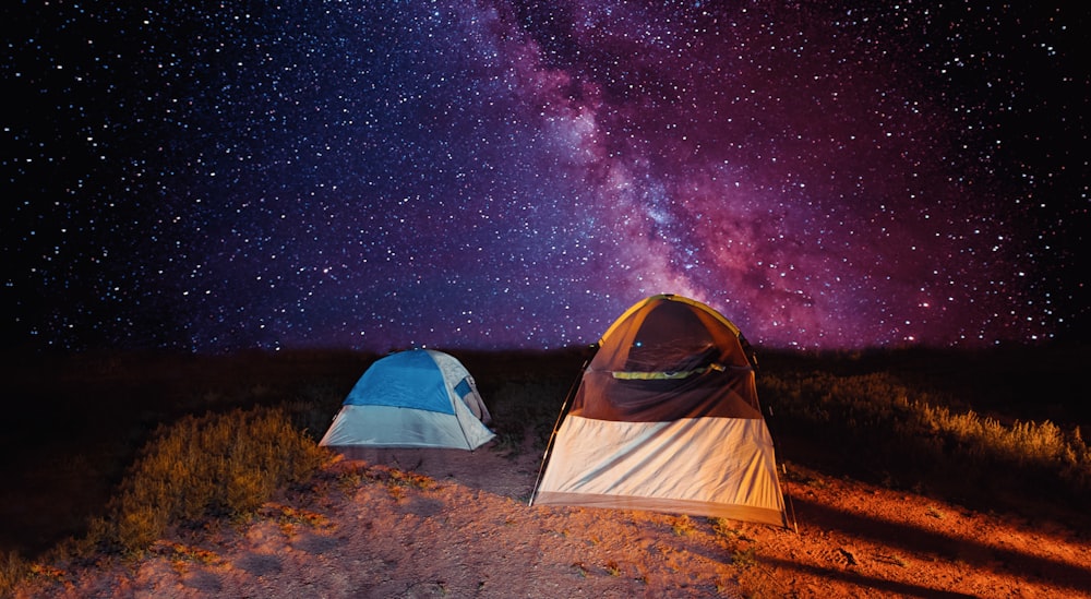 white and blue tent under starry night