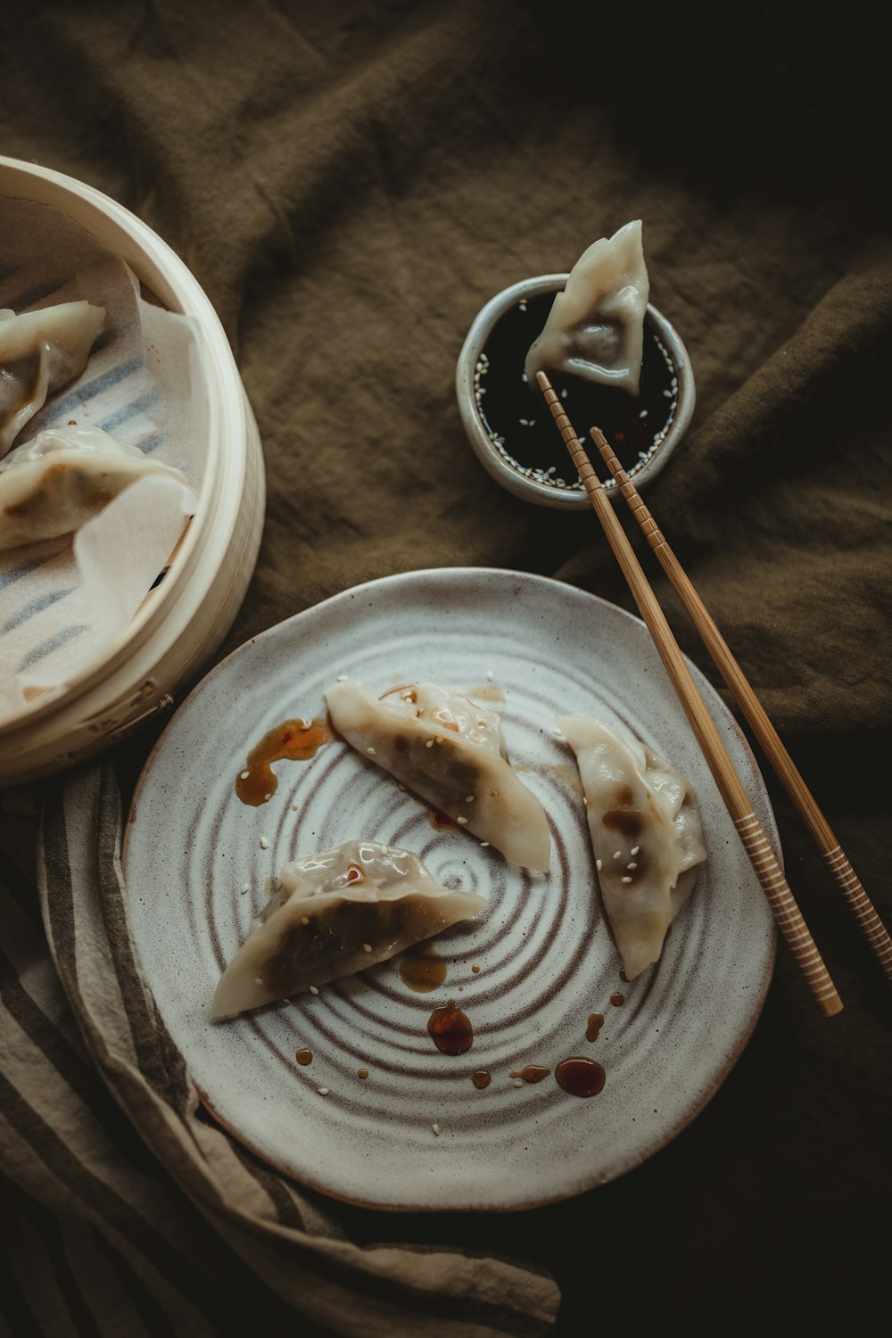 white ceramic plate with food on black textile