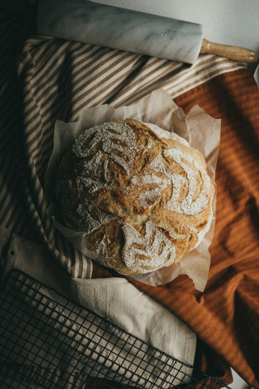 brown and white bread on white paper