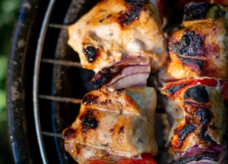 grilled meat on black metal grill