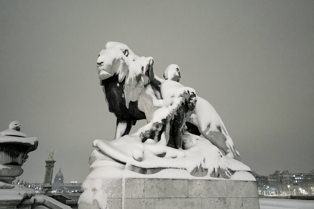 white concrete statue of man riding horse