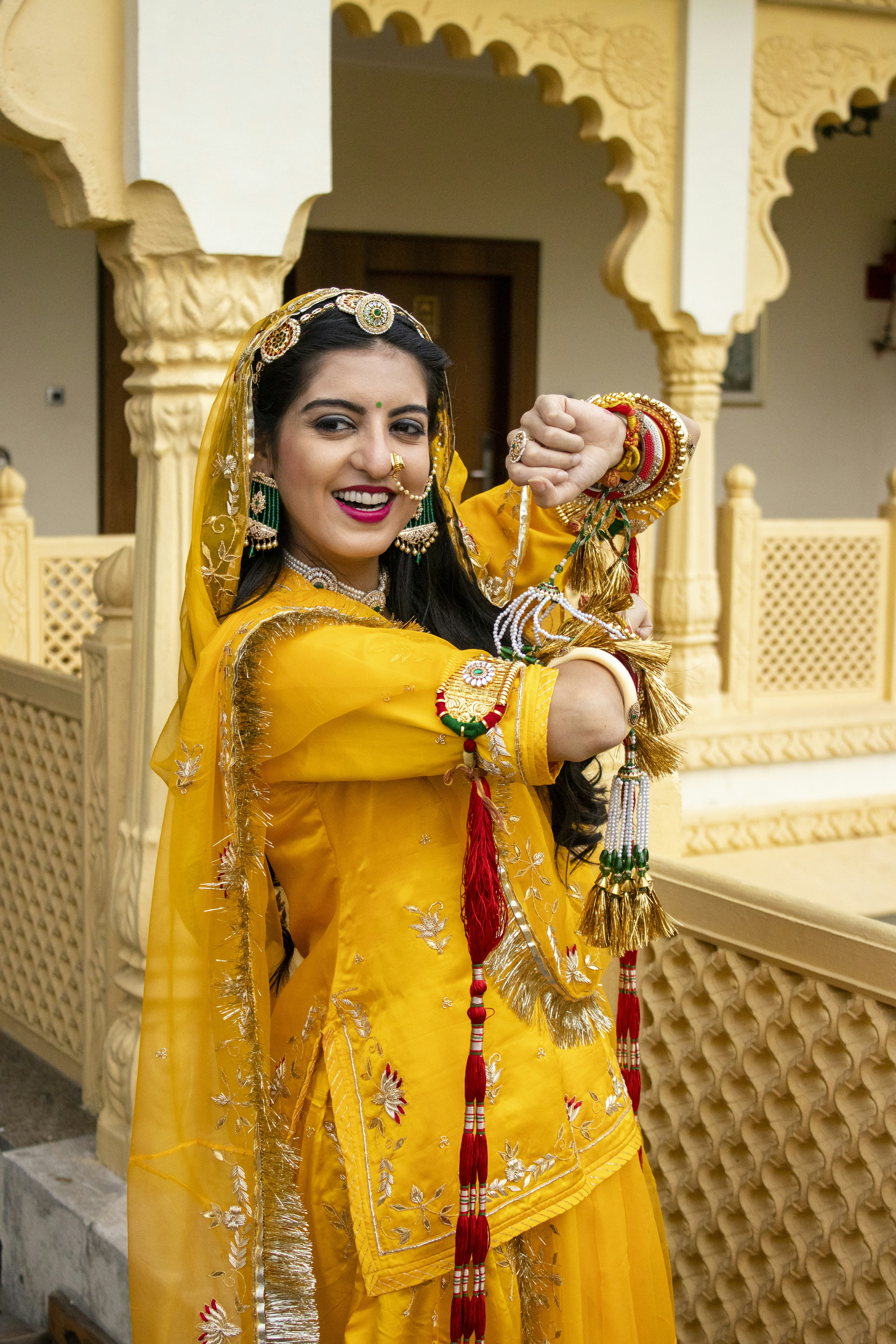 Smiling Indian woman in festive attire, warm toned portrait