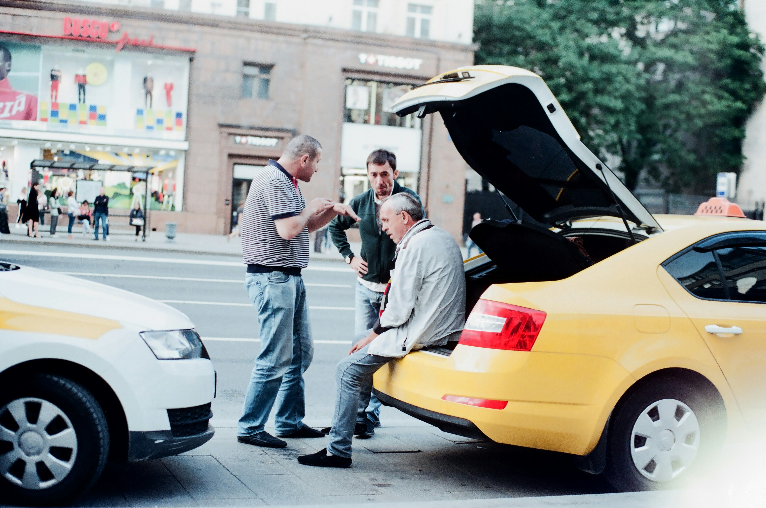 A buyer inspecting a used vehicle for potential issues