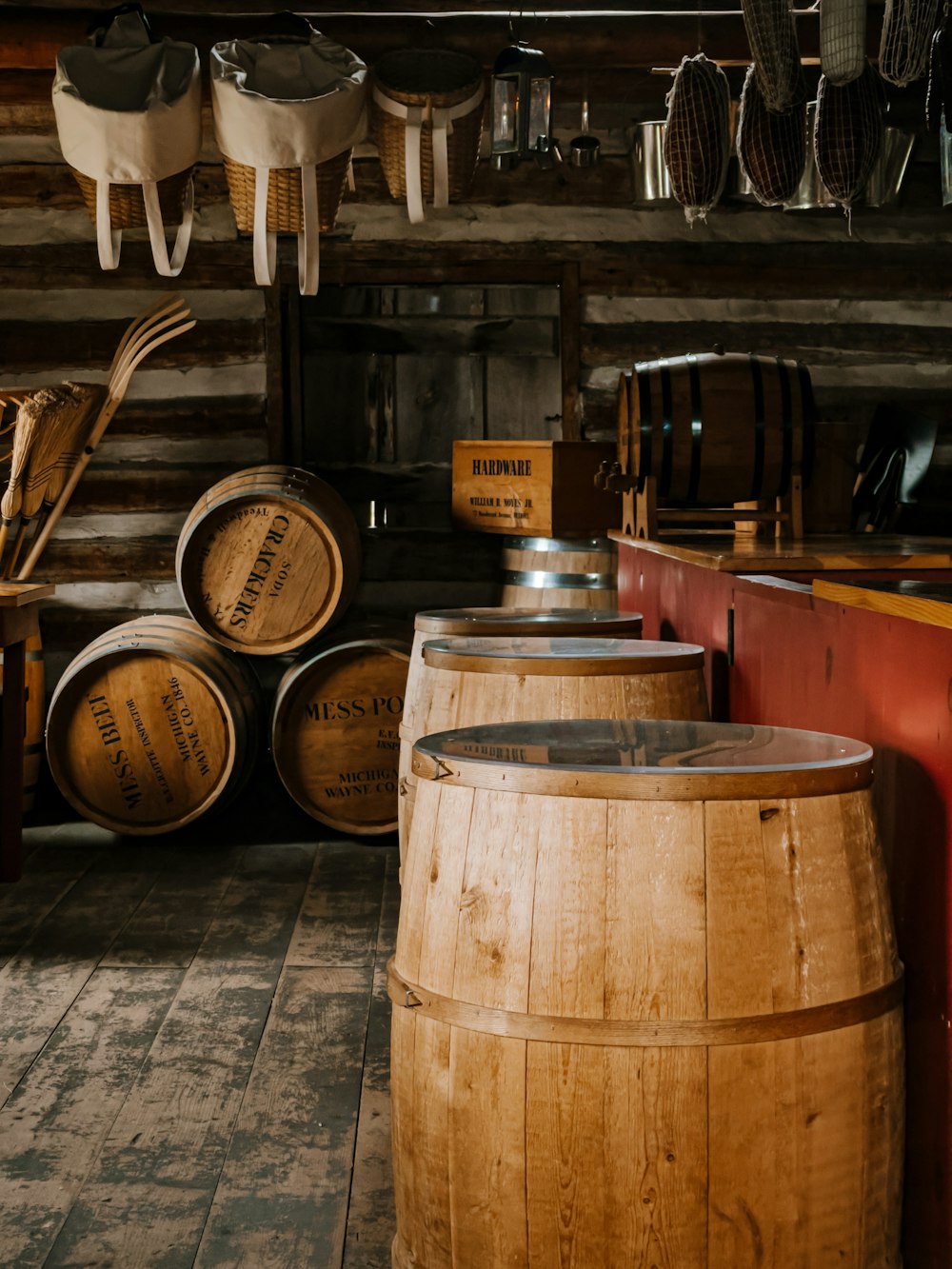 brown wooden barrels on brown wooden floor