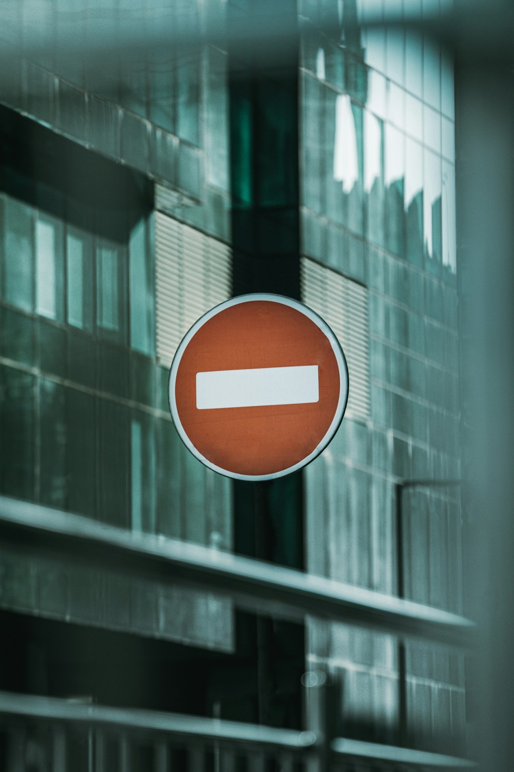 red and white round sign