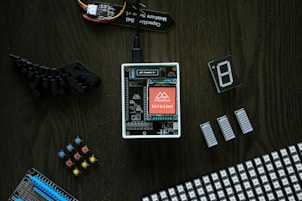 electronic components laid out on a wooden table