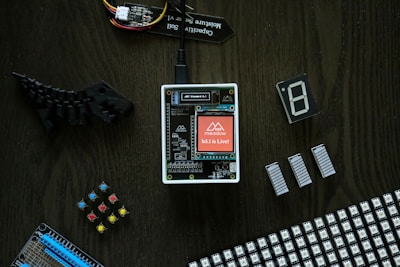 electronic components laid out on a wooden table