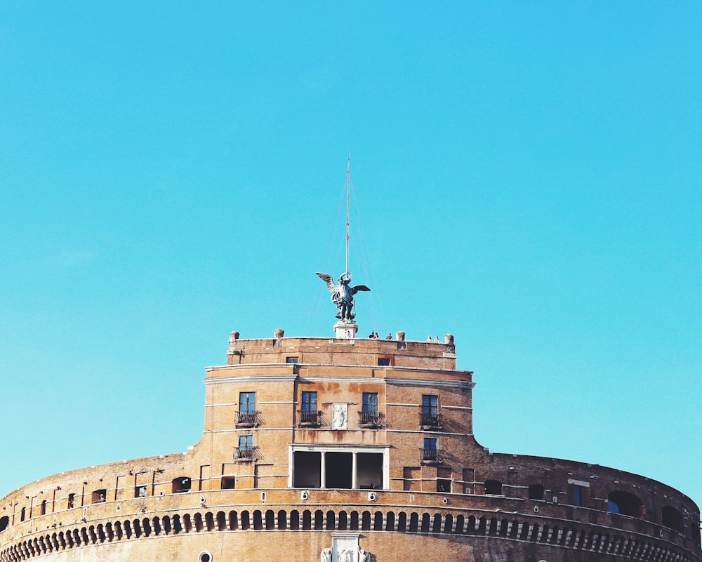 brown concrete building under blue sky during daytime