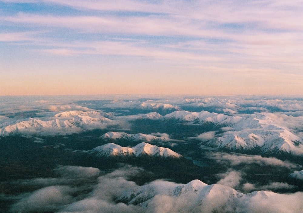 white clouds over mountains during daytime