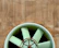 Close-up of a clean, well-maintained mechanical ventilation unit with blue and green accents.