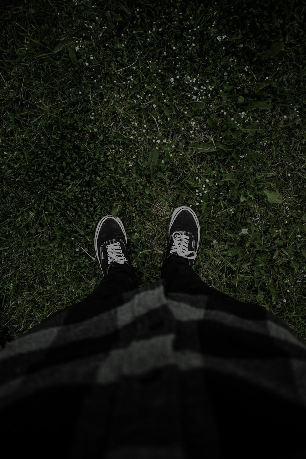 person in black and white sneakers