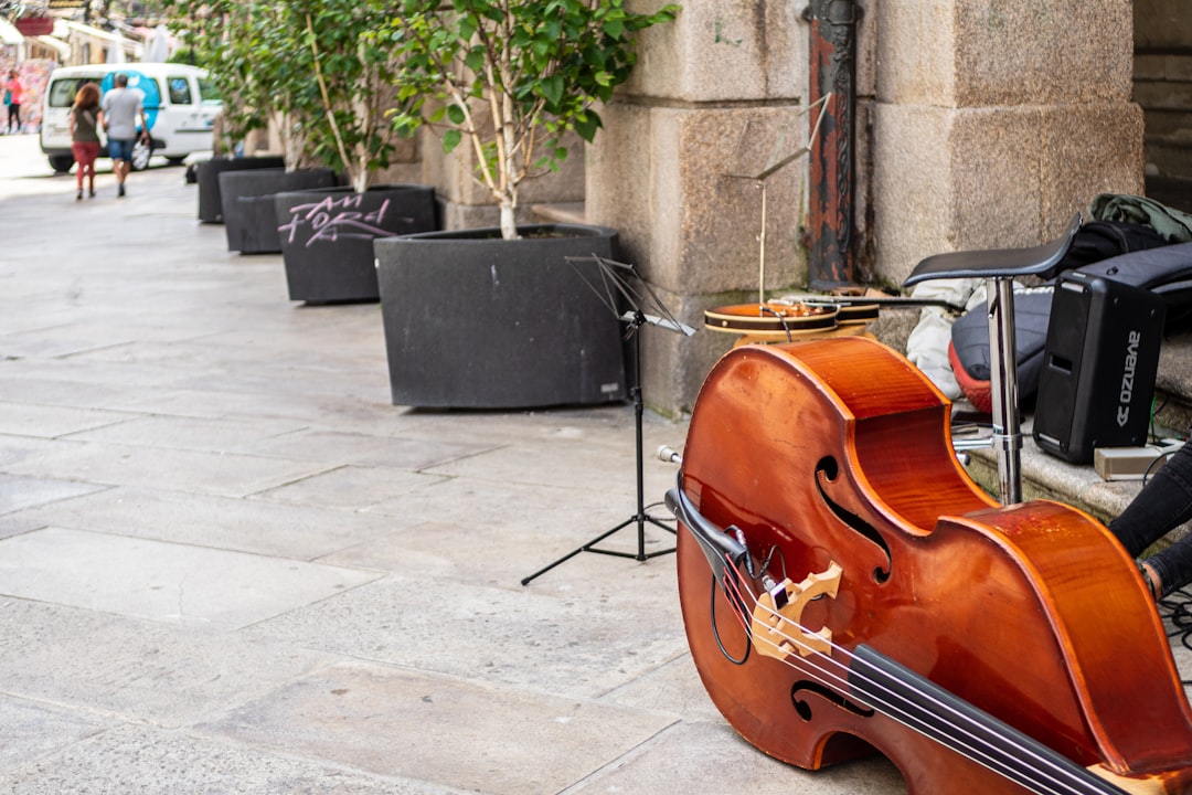 brown violin on gray concrete floor