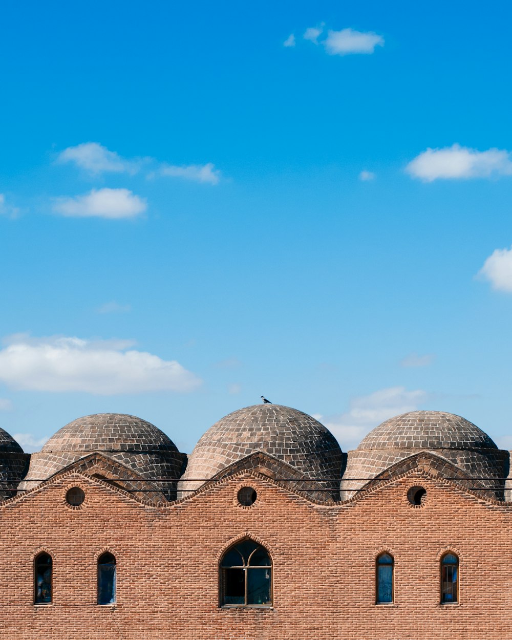 brown concrete building under blue sky during daytime