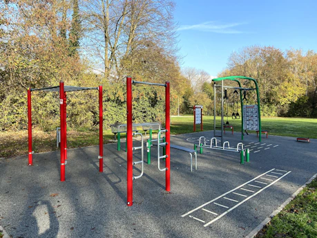 Outdoor steel fitness equipment in a modern park setting, ready for installation