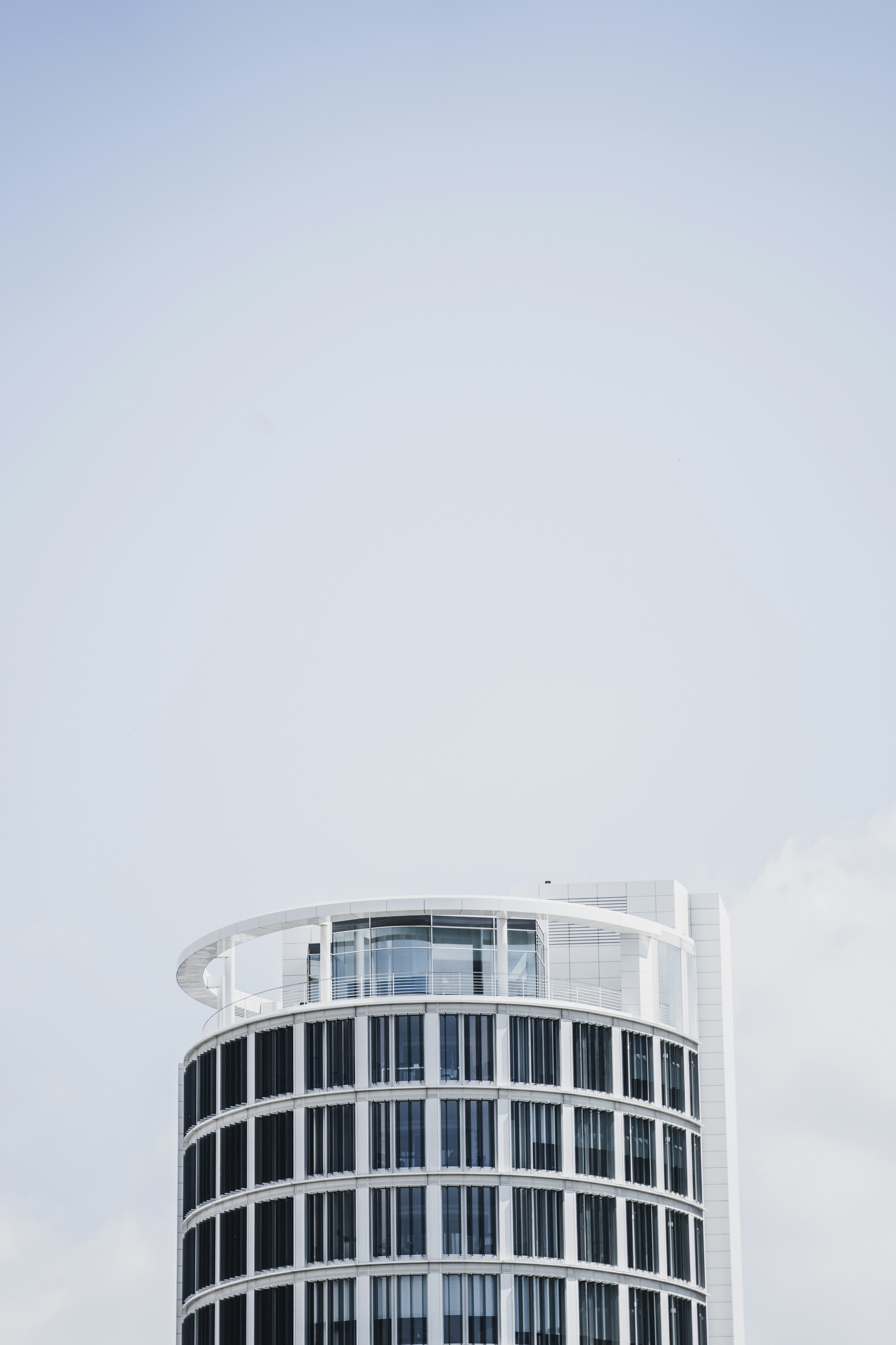 white concrete building under white sky during daytime