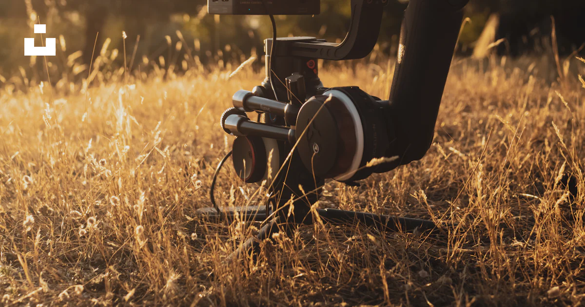 Camera In Field Black video camera on brown grass field during daytime photo – Free ...