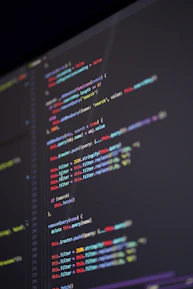 Close-up of code on a computer screen with colorful syntax highlighting.