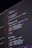 A close-up view of computer code displayed on a dark screen, featuring syntax highlighted in various colors such as red, blue, green, and yellow against a black background. The code appears to be JavaScript, containing functions, variables, and commands.