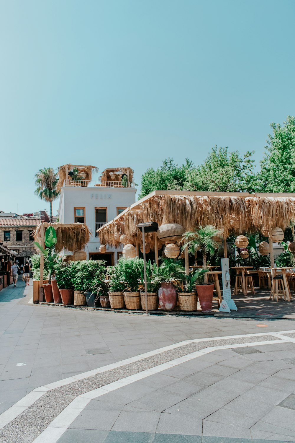 brown wooden houses near green trees during daytime