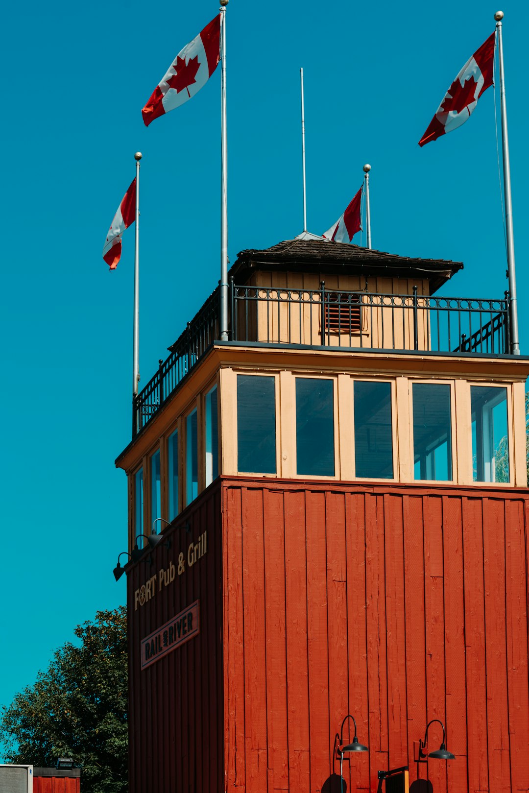 brown and white concrete building with flag of us a during daytime