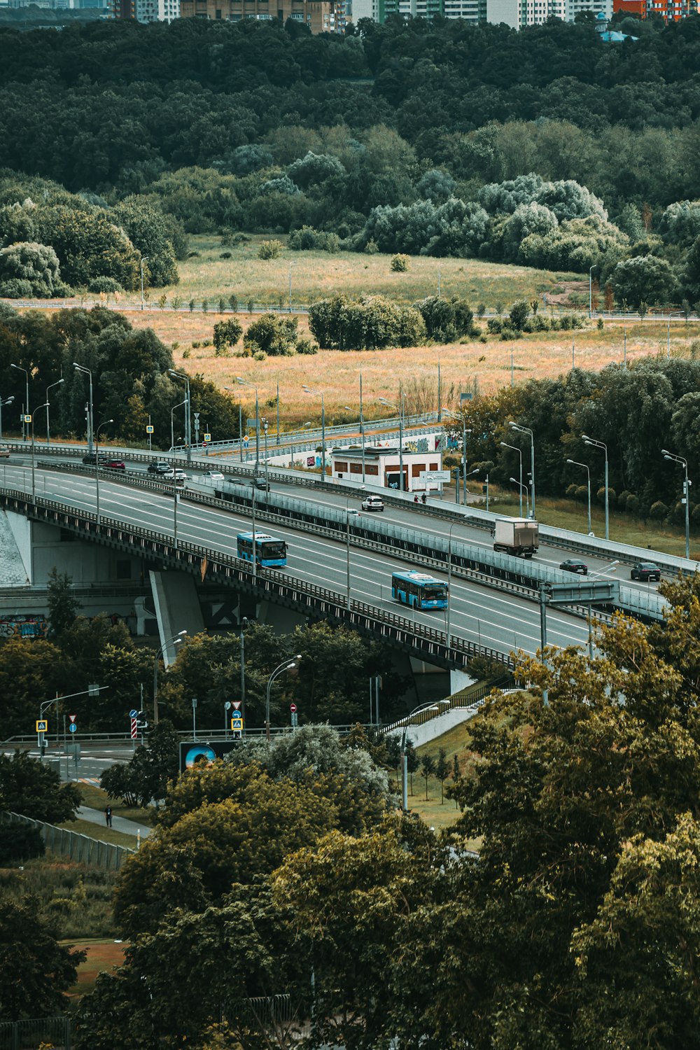 white and blue train on rail road during daytime