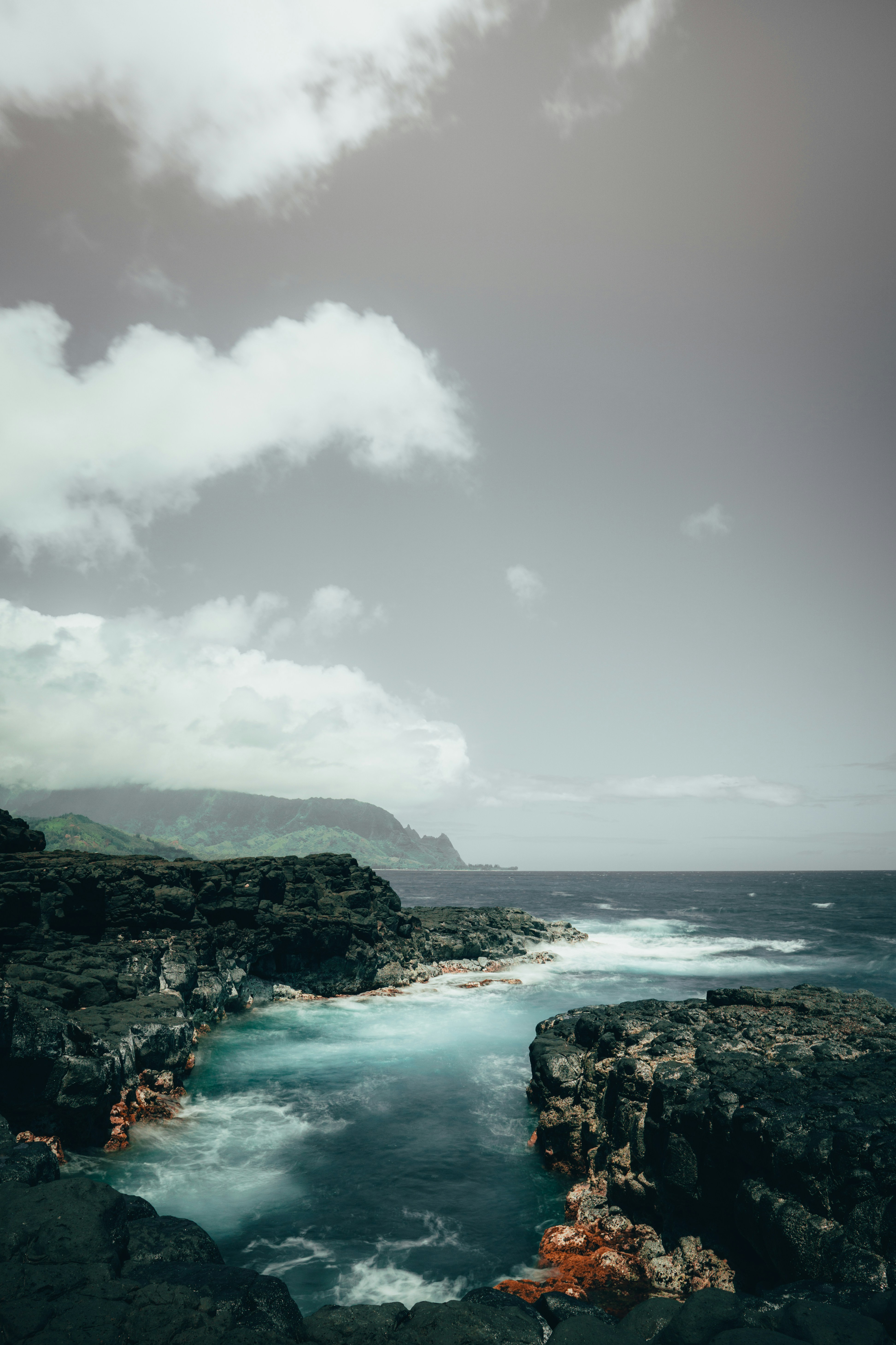 body of water under cloudy sky during daytime
