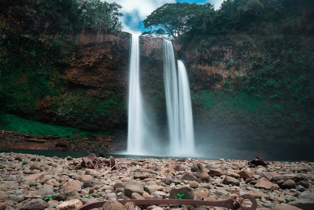 waterfalls on rocky ground during daytime