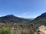 A breathtaking landscape featuring rolling hills and a blue sky.