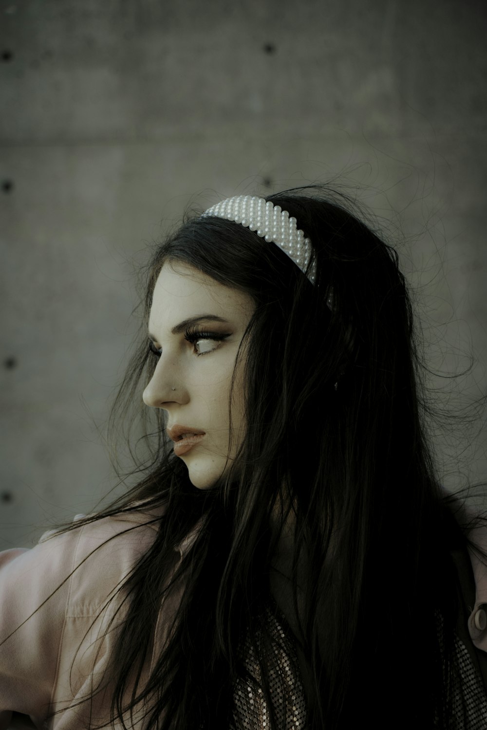 woman in white and black polka dot headband