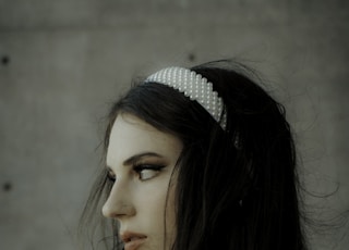 woman in white and black polka dot headband