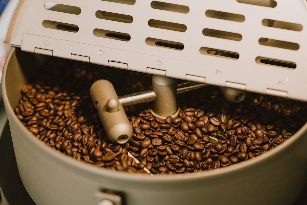 a coffee grinder filled with coffee beans