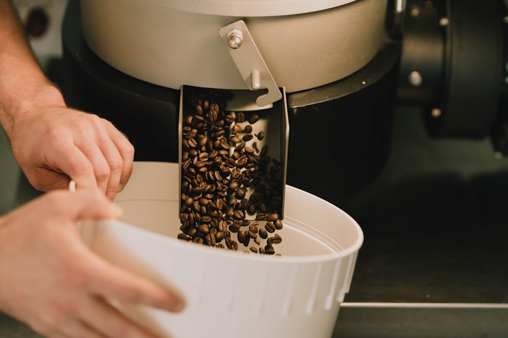 white plastic container with brown coffee beans