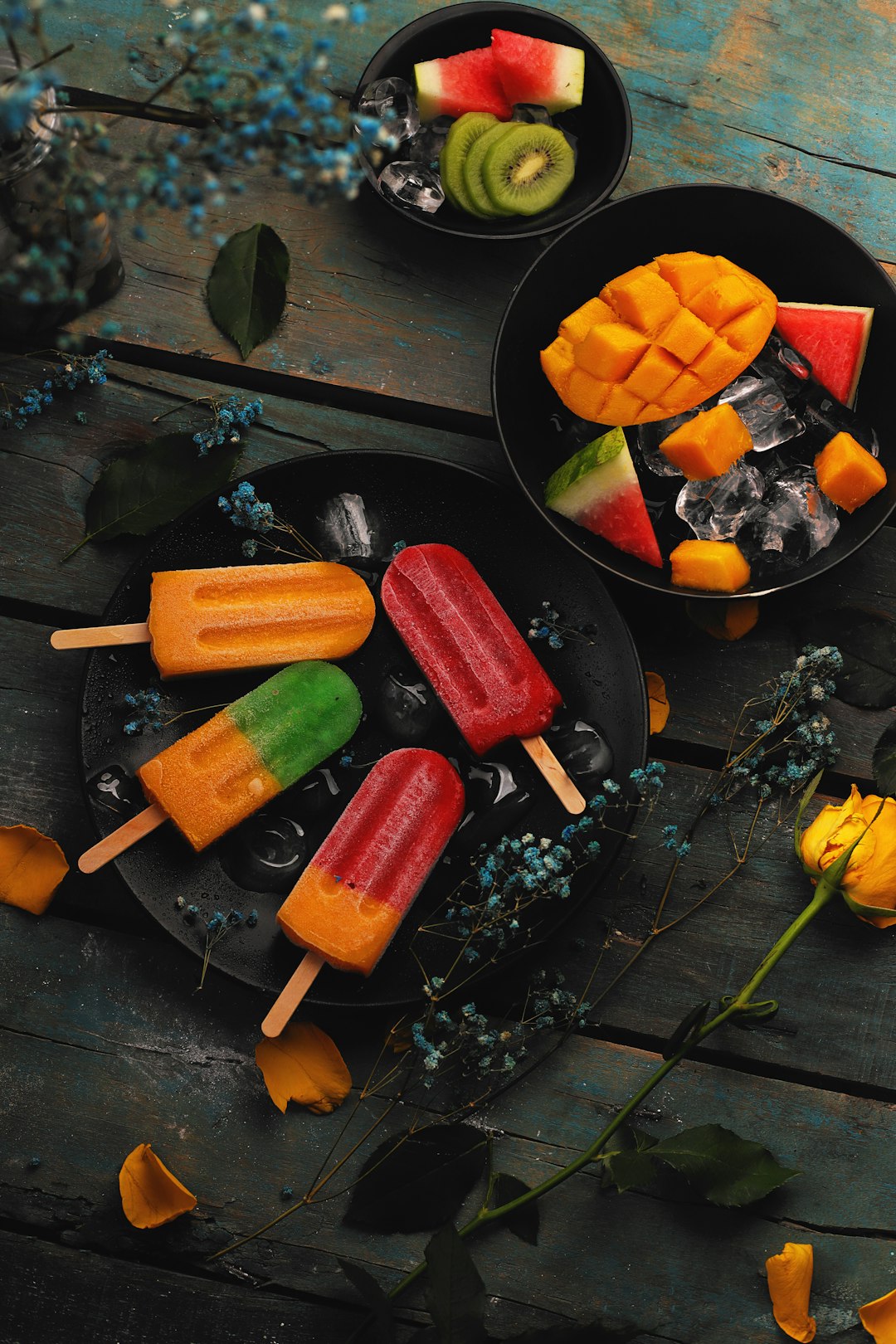 sliced fruits on black round plate