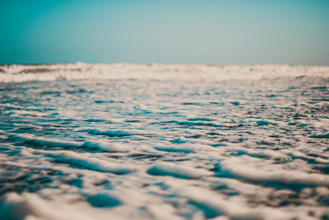 blue ocean water under blue sky during daytime