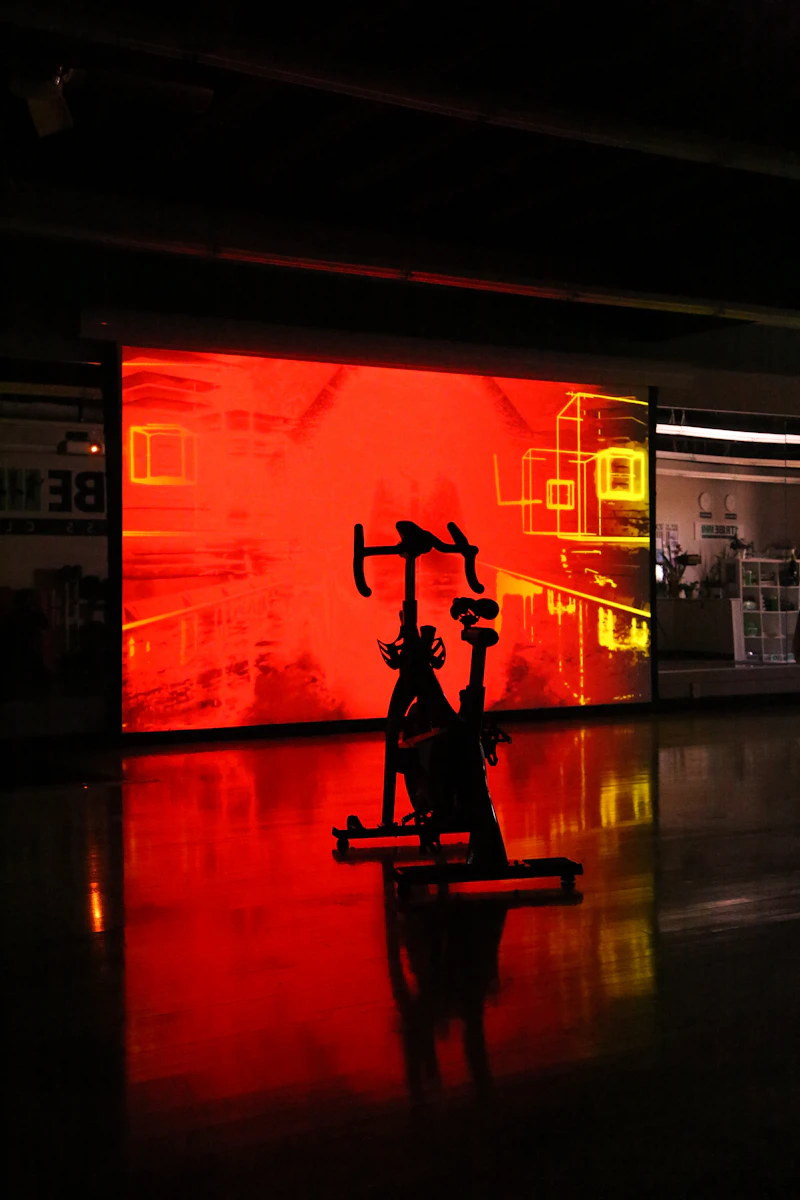 Rider standing on the pedals during a high-resistance Power Ride